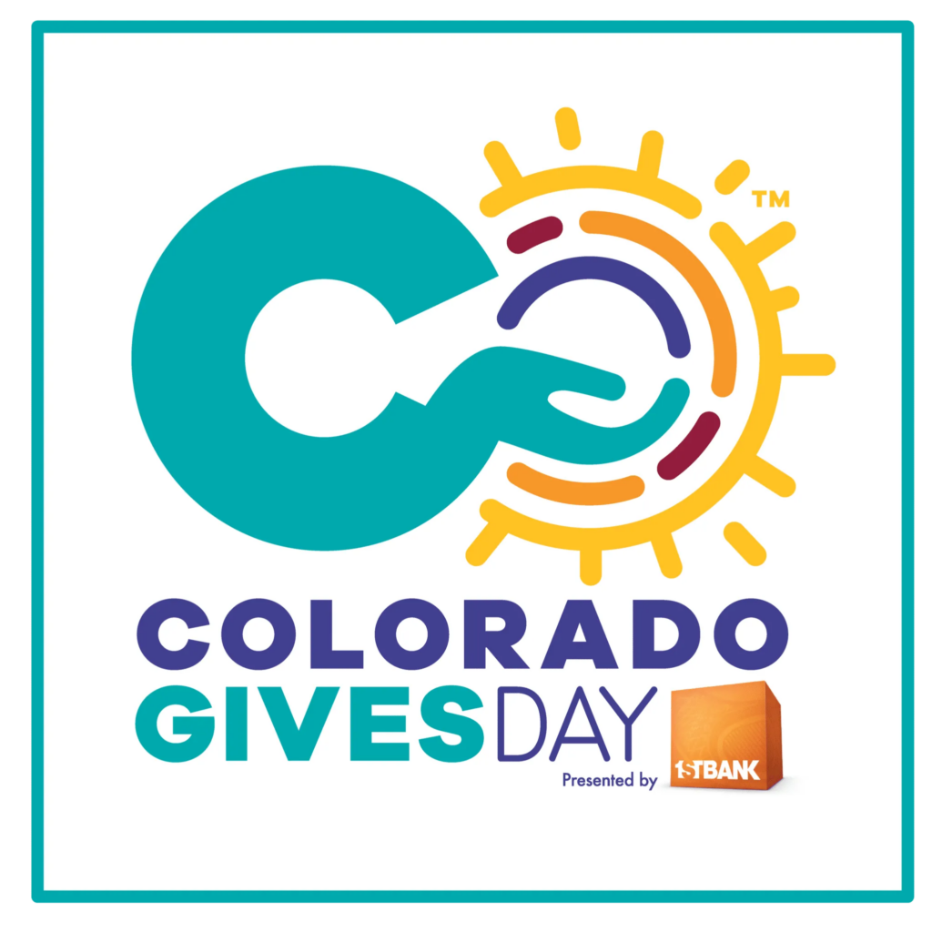 The Colorado Gives Day logo showing a C shaped like an arm with an outstretched hand, reaching into an O the shape of the sun. Text below the logo reads Colorado Gives Day presented by 1st Bank. The logo uses a color scheme of teal blue, purple, yellow, and orange.