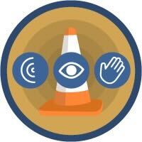 Salesforce Trailhead badge featuring an orange traffic cone centered in a circular emblem, with three blue icons around it representing sound (ear), vision (eye), and touch (hand), symbolizing accessibility and inclusive design.